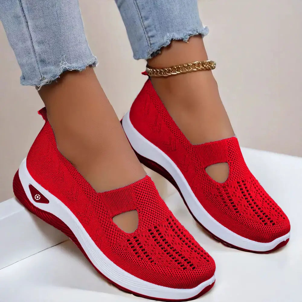 Women’s breathable mesh slip-on casual flats in red knitted fabric with white rubber sole and side logo detail