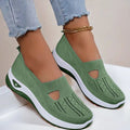 Green women’s breathable mesh slip on casual flats with t-strap design and white dark green sole