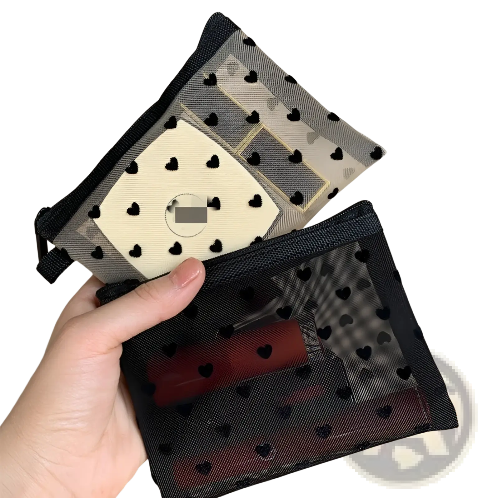Black mesh makeup bag with black heart polka dot pattern and zipper closure for cosmetic storage