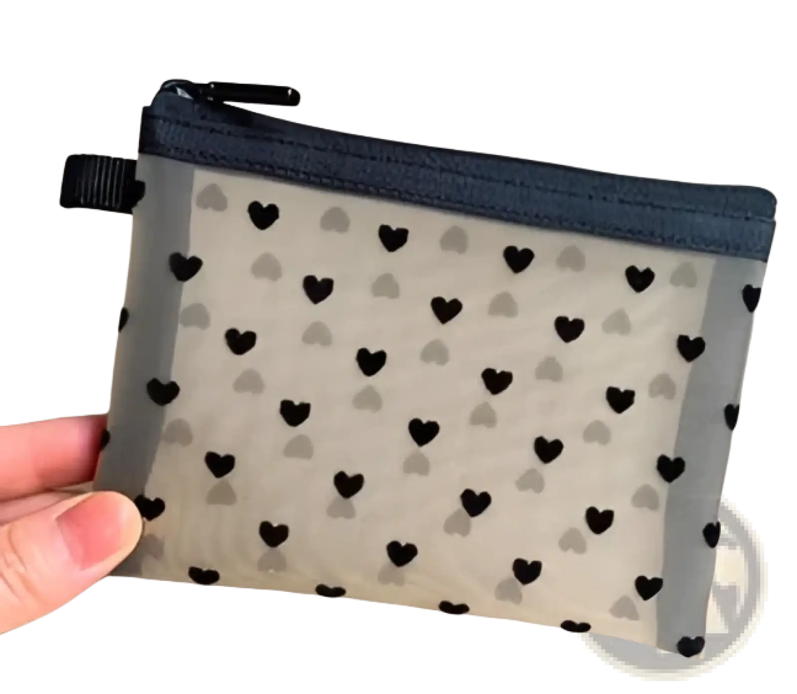 Clear mesh makeup bag with black heart polka dot pattern and navy blue zipper for cosmetic storage
