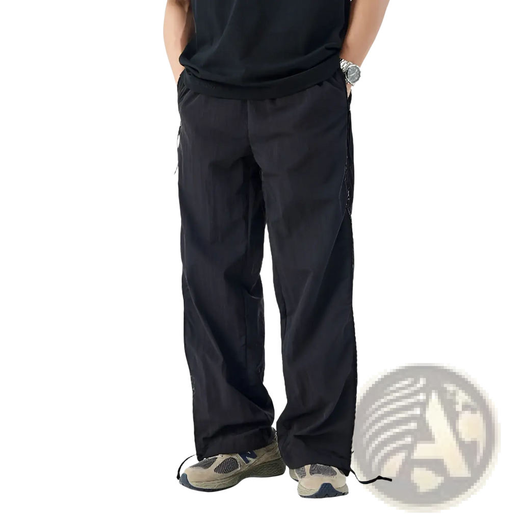 Black wide-leg mesh side panel utility hiking pants with cargo pockets side zippers and ankle drawstrings