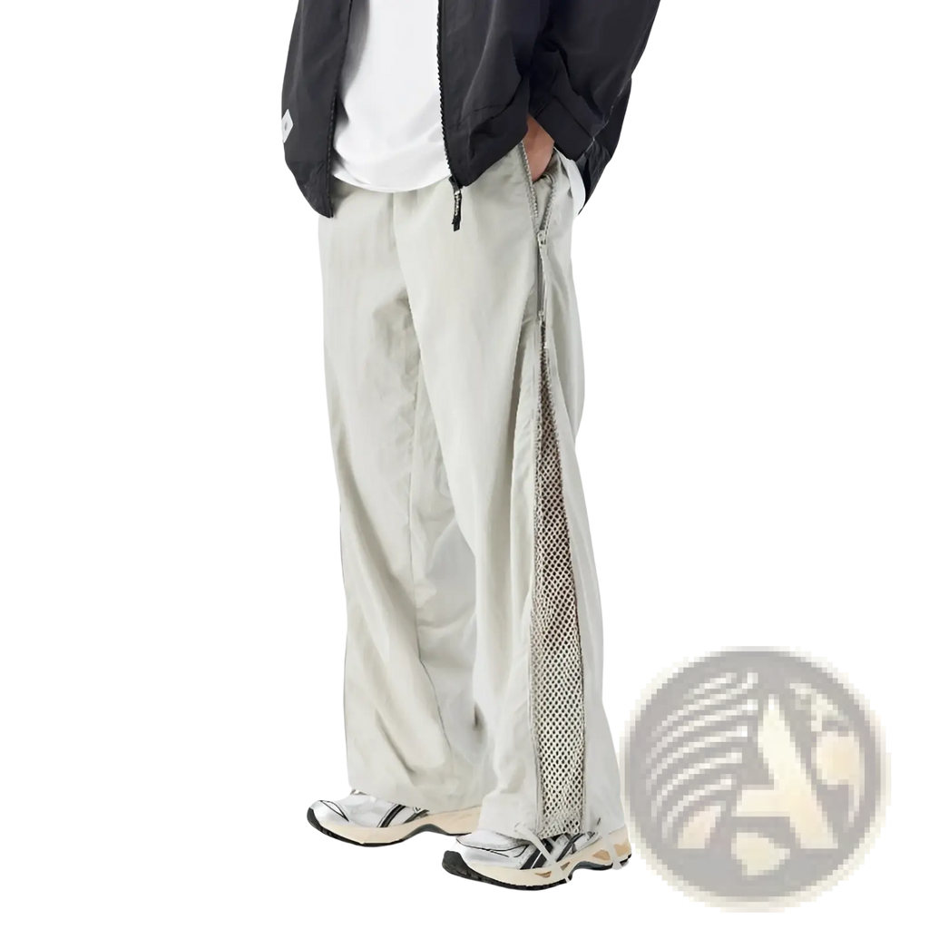 Light gray wide-leg utility hiking pants with mesh panel along the side seam for ventilation and style