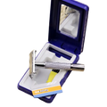 A sleek metal chrome safety razor with textured grip in an open blue case holding replacement blades and mirror