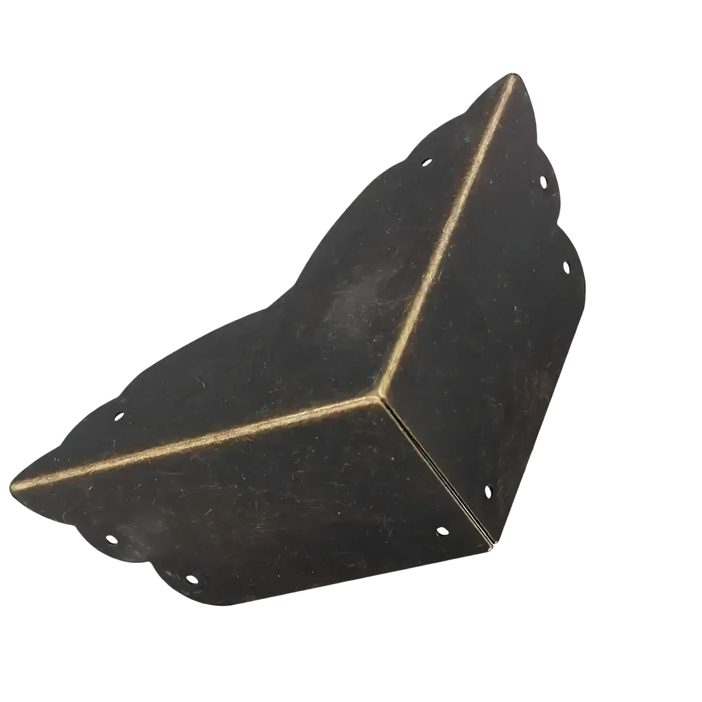 Antique brass-finished metal corner protector with scalloped edges and pre-drilled holes for furniture and tables