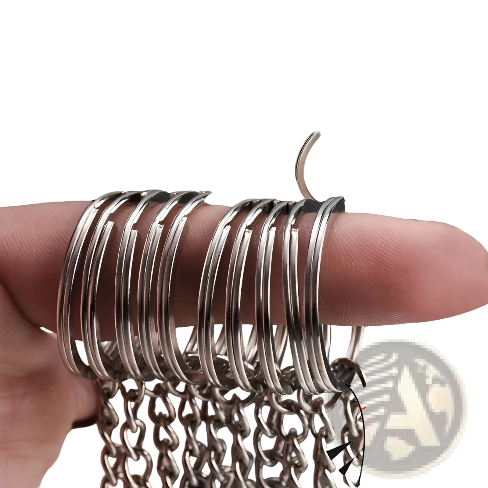 A stack of silver-toned metal keychains with split rings and chains featuring a smooth polished finish