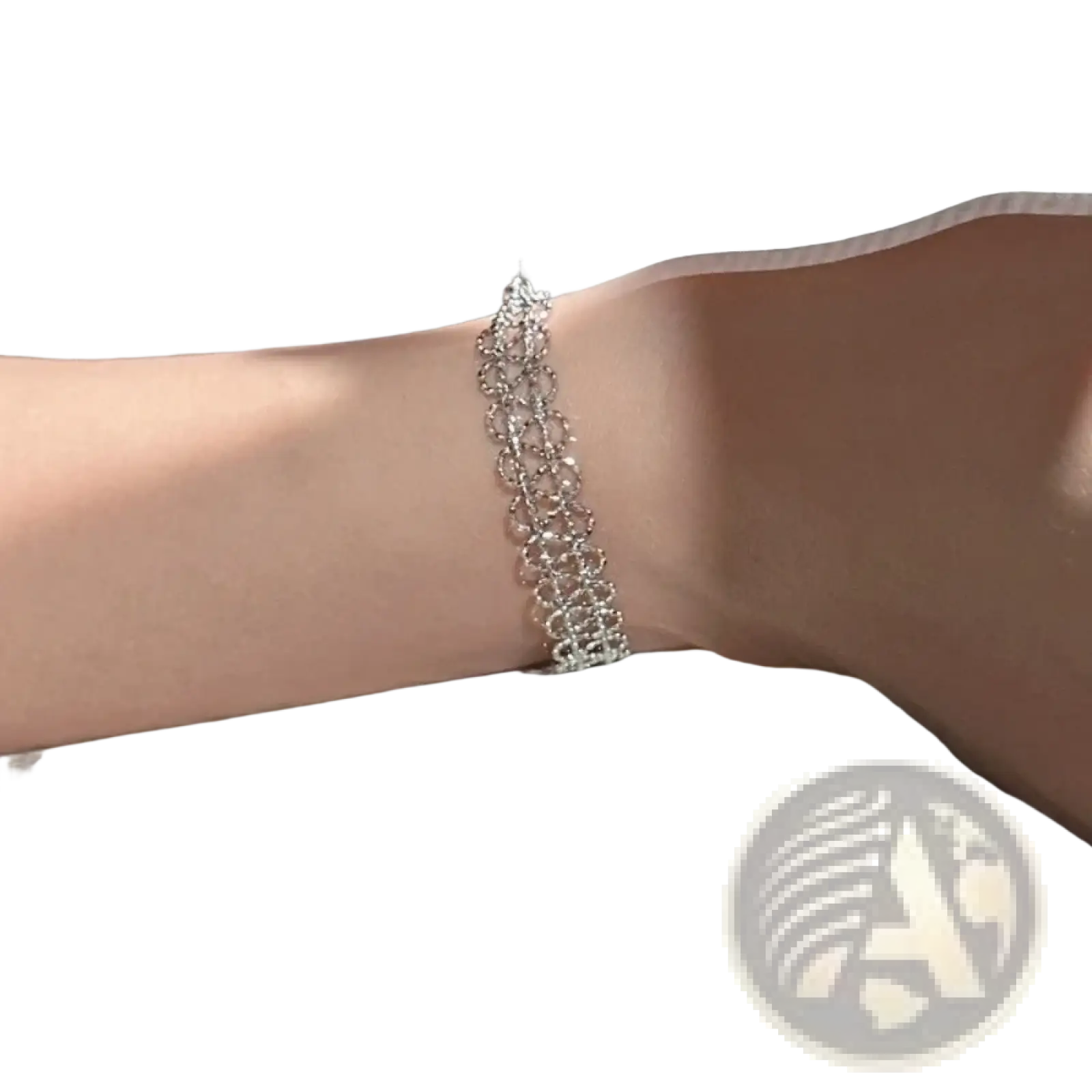 A delicate silver-toned metal lace bracelet with adjustable design and sparkling crystal woven embellishments