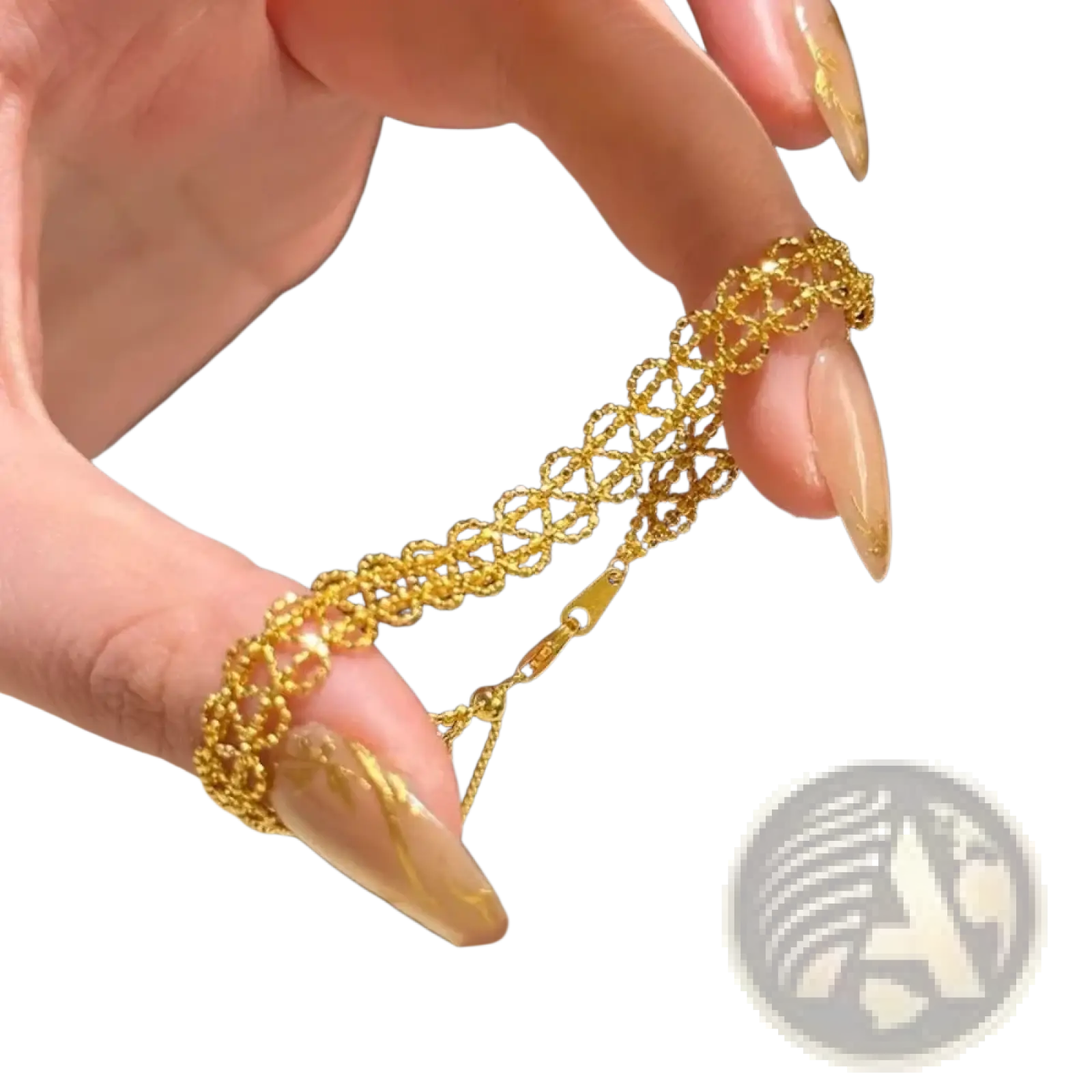 A delicate gold metal lace bracelet with an intricate interlocking circular design and adjustable clasp