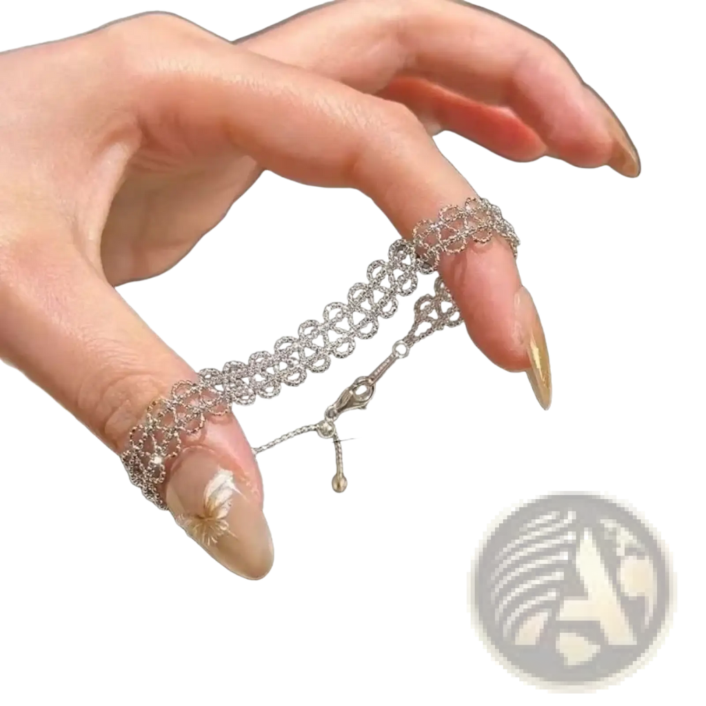 Silver chain finger ring with intricate lace-like design and small dangling charm from metal lace bracelet adjustable fashion jewelry collection