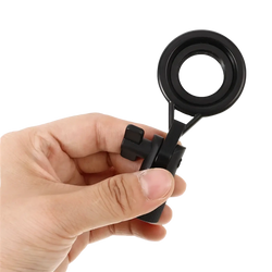 Black metal microphone stand clip with adjustable mount and ergonomic handle featuring a circular lens magnifier