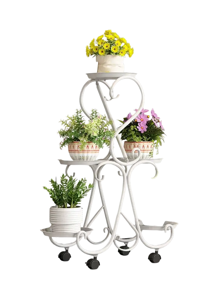 White metal plant stand with ornate scrollwork and black rolling wheels for flower pot display