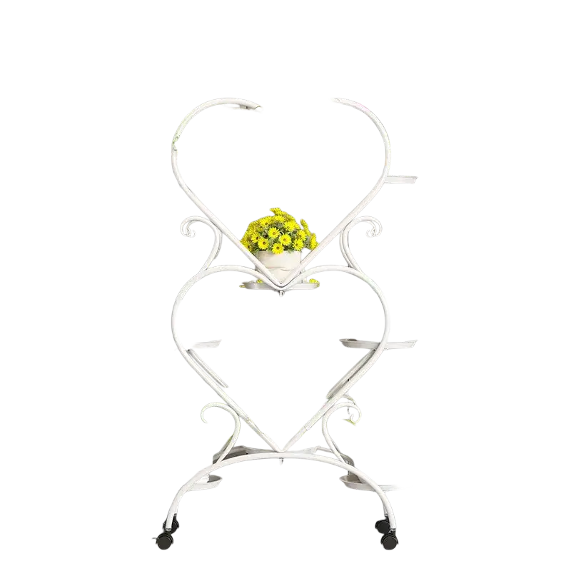 White heart-shaped metal plant stand with rolling wheels for flower pot display and easy mobility