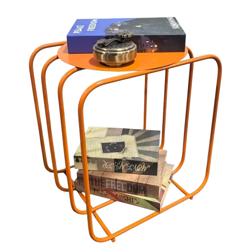 Orange metal frame side table with circular top and open shelving for minimalist magazine storage