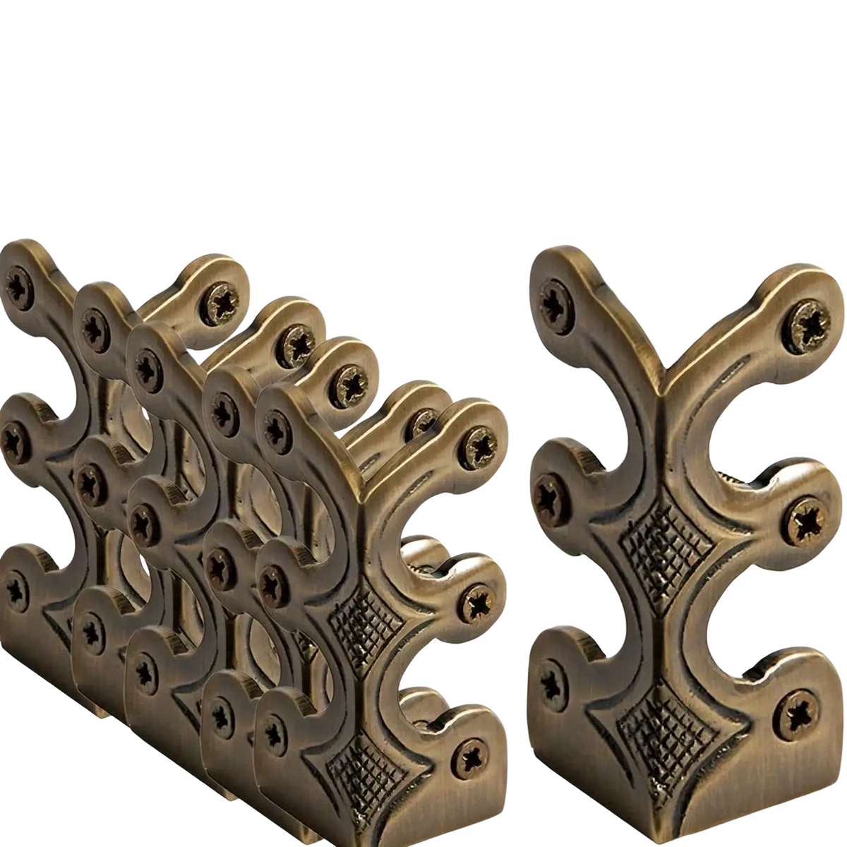 Antique brass-finished metal skirting board edge guards and corner protectors with intricate scrollwork and diamond pattern detailing