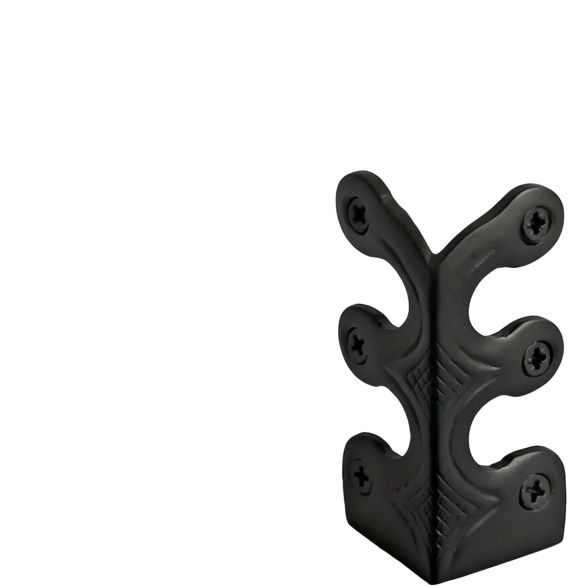 Black metal corner protector with ornate leaf design and four screw holes for metal skirting board edge guards