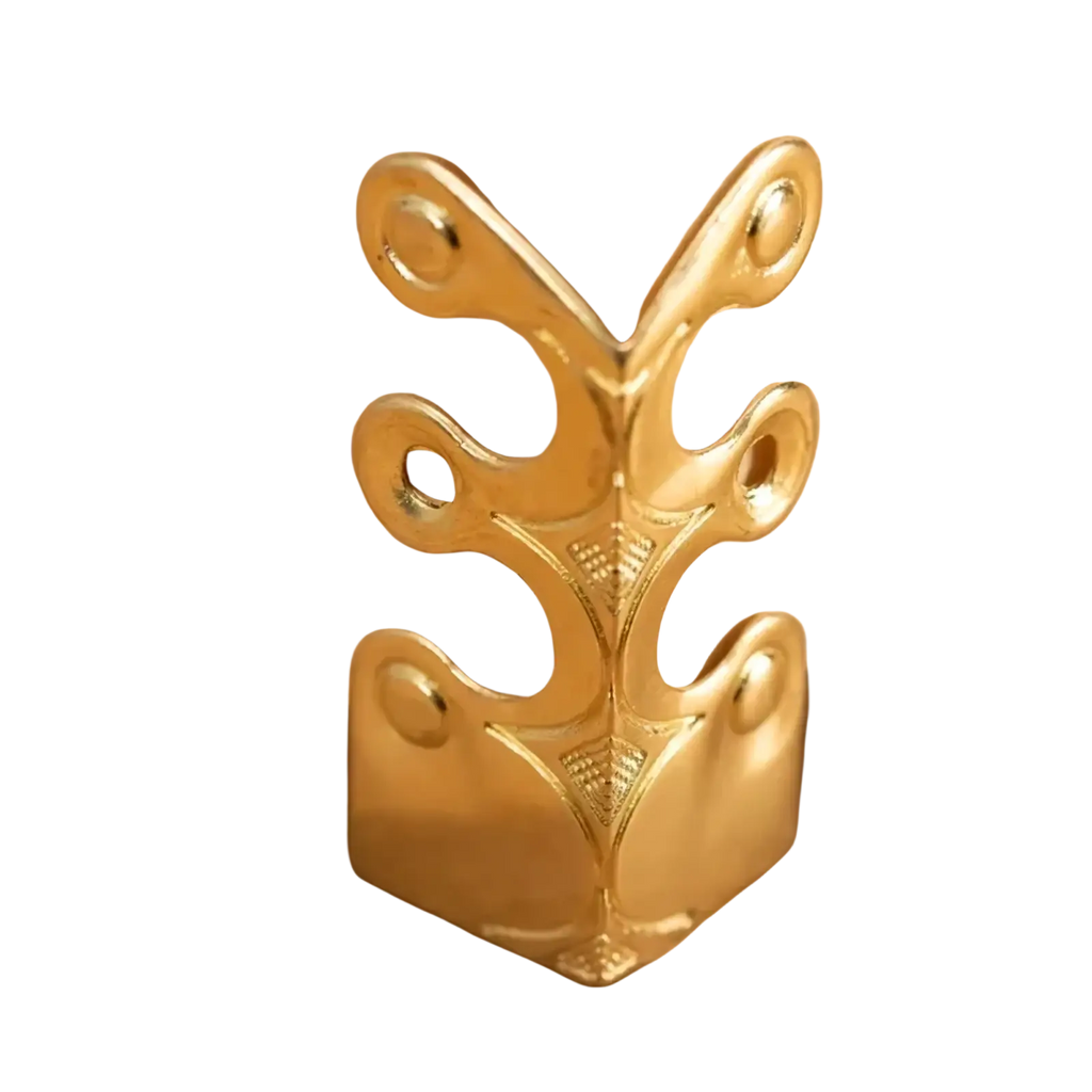 Gold-colored ornate metal corner protector with leaf cutouts and polished finish for metal skirting board edge guards