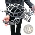 Silver metal sea turtle wall art with minimalist lattice cut-out design for sea life decor