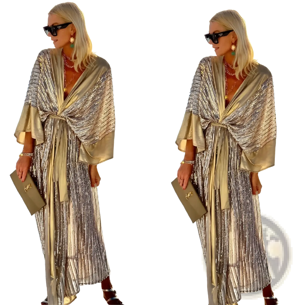 A shimmering gold sequined metallic bat sleeve pleated maxi dress with a draped flowing design and wide sleeves