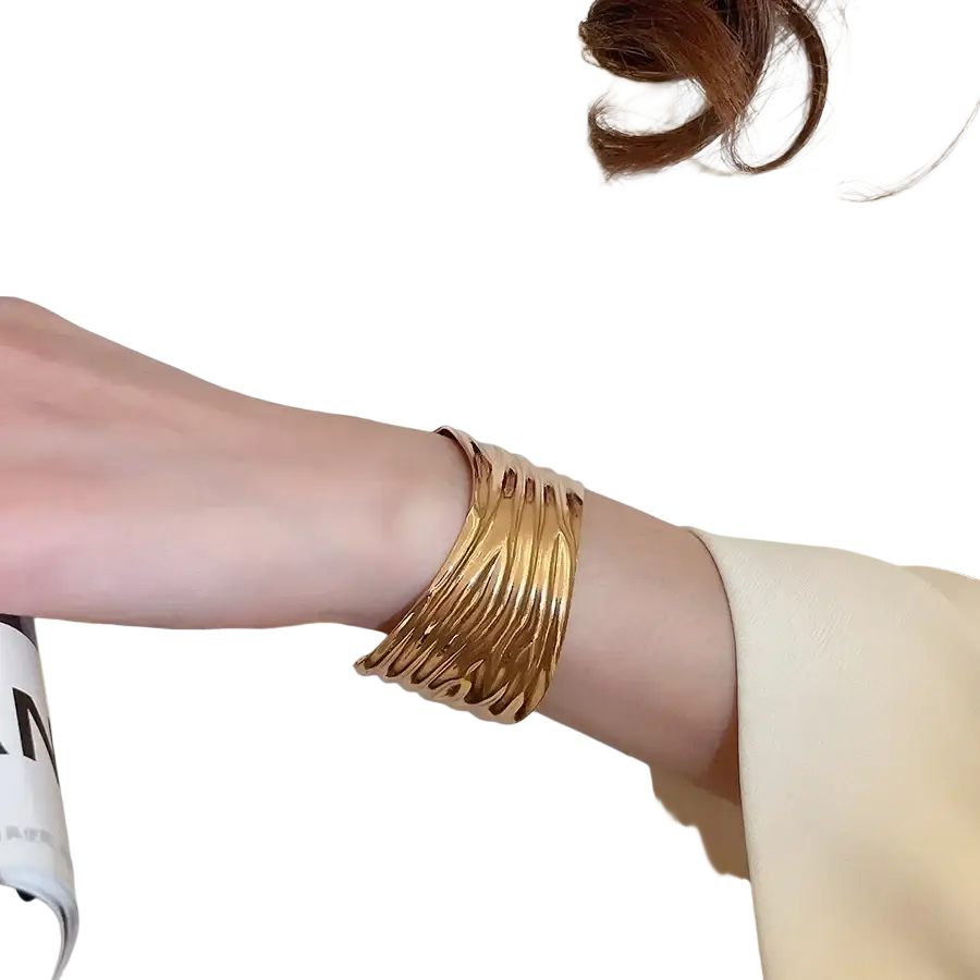 Gold-toned metallic pleated cuff bracelet for women featuring a sleek multi-layered modern design