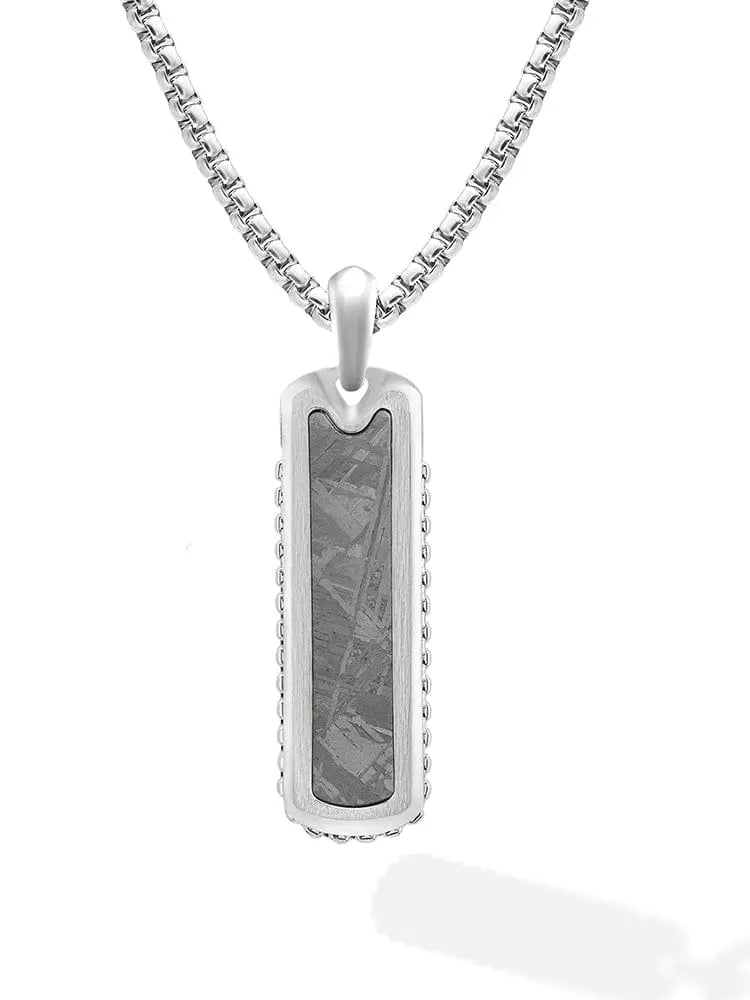 Silver stainless steel dog tag pendant necklace with dark textured Muonionalusta meteorite inlay and crystalline patterns