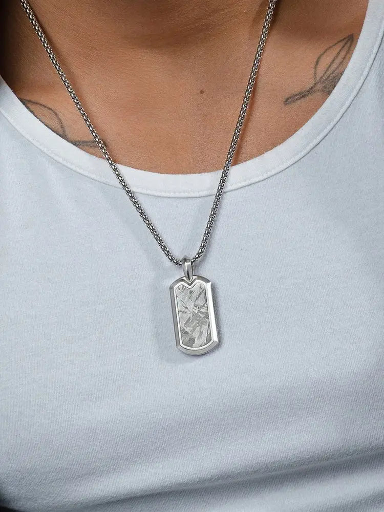 Muonionalusta meteorite dog tag necklace in stainless steel with a textured crystalline silver pendant suspended from chain