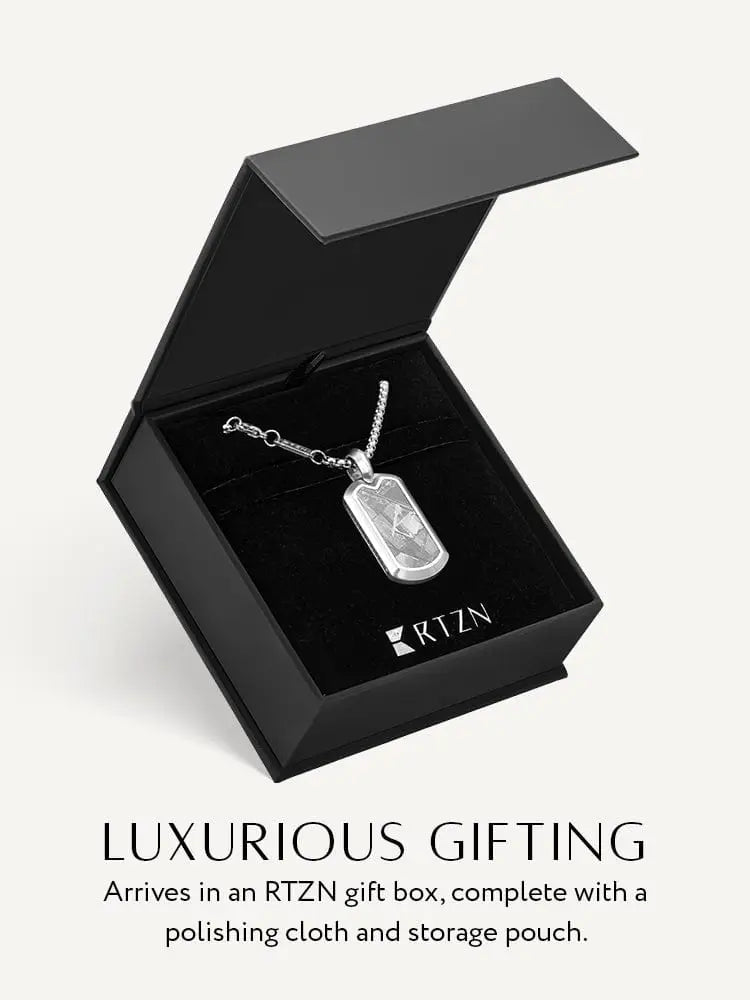 Silver muonionalusta meteorite dog tag necklace with engraved design and sleek stainless steel chain