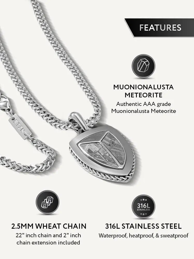 Silver shield-shaped pendant with authentic aaa grade muonionalusta meteorite inlay on 316l stainless steel wheat chain