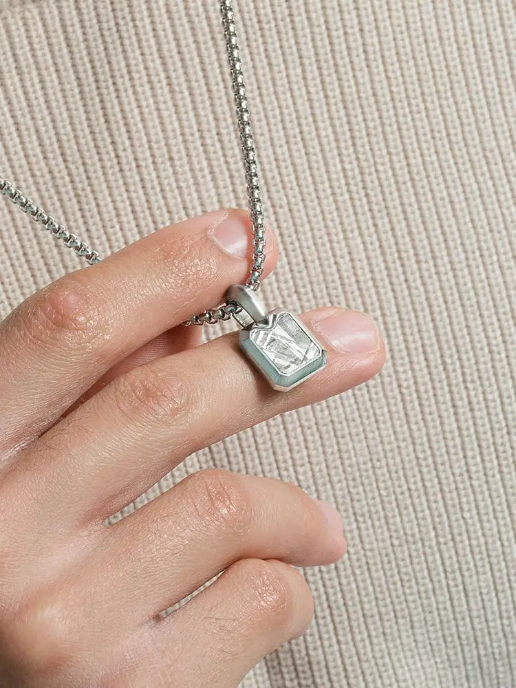 Muonionalusta meteorite rectangular stainless steel necklace with a silver-toned pendant and clear faceted gemstone