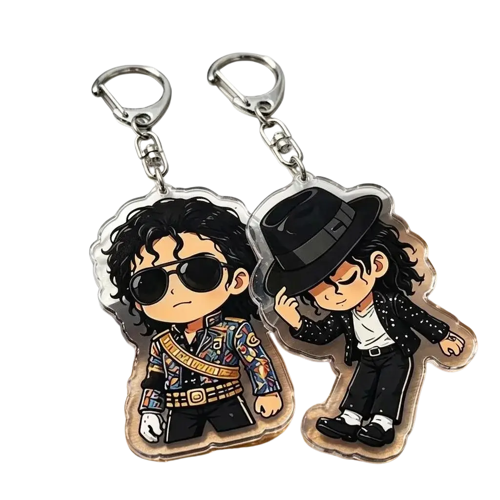 Two clear acrylic michael jackson chibi keychains featuring colorful and black outfit illustrations with iconic accessories