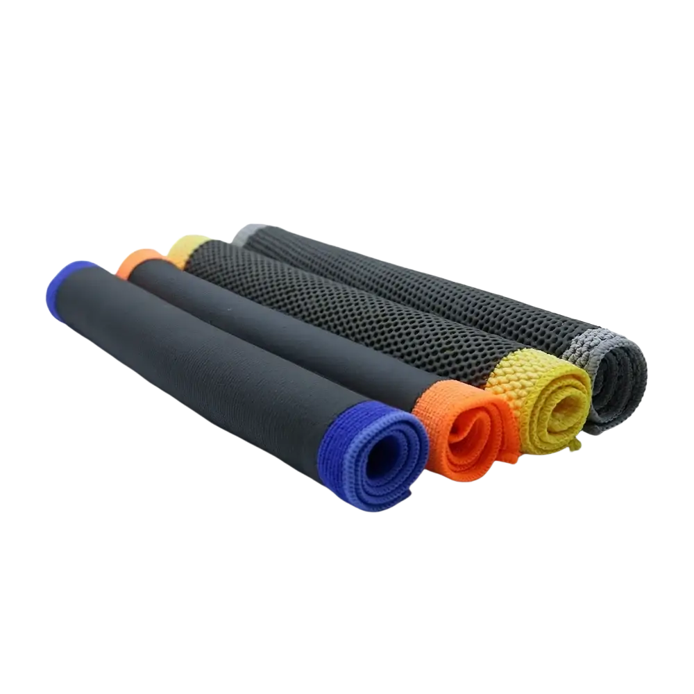 Set of five rolled microfiber car clay towel detailing cloths in black blue orange yellow and gray with textured surfaces
