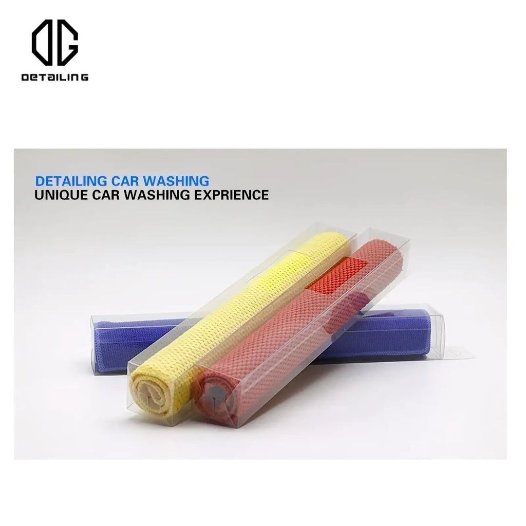 Three rolled-up microfiber car clay towel detailing cloths in yellow red and blue displayed in clear plastic packaging