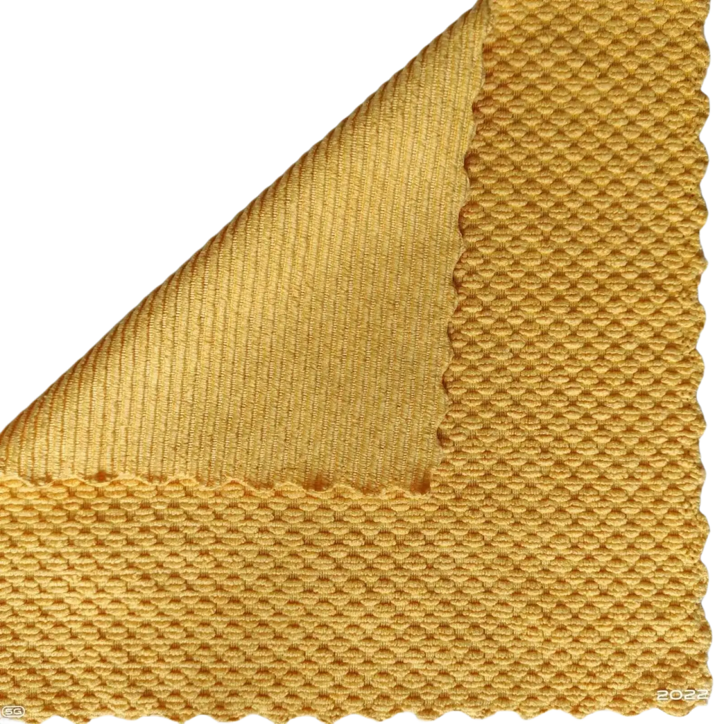 Yellow microfiber kitchen cleaning cloth sample showing textured woven pattern and ribbed underside for absorbency