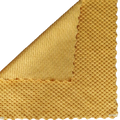 Yellow microfiber kitchen cleaning cloth sample showing textured woven pattern and ribbed underside for absorbency