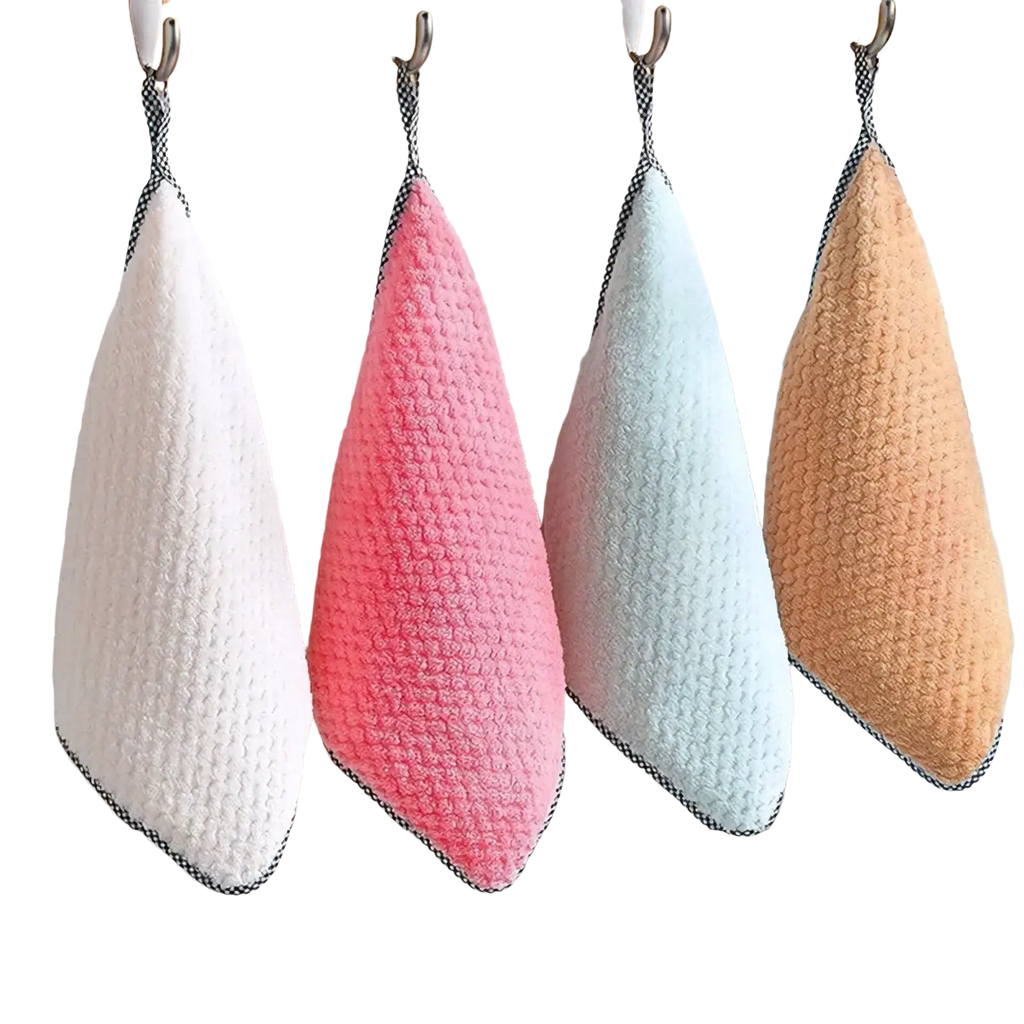 Four colorful microfiber kitchen dish cloths in white pink light blue and beige with textured weave hanging on hooks
