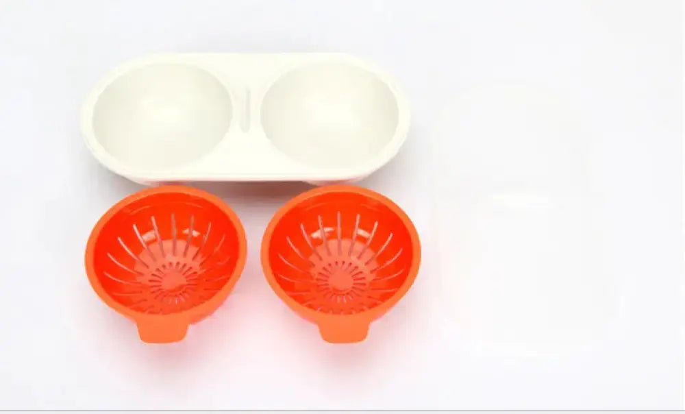 Orange plastic microwave double cup egg poacher and boiler with two circular compartments and matching white lid