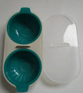 Teal silicone microwave double cup egg poacher and boiler with clear plastic lid and integrated handles for easy use