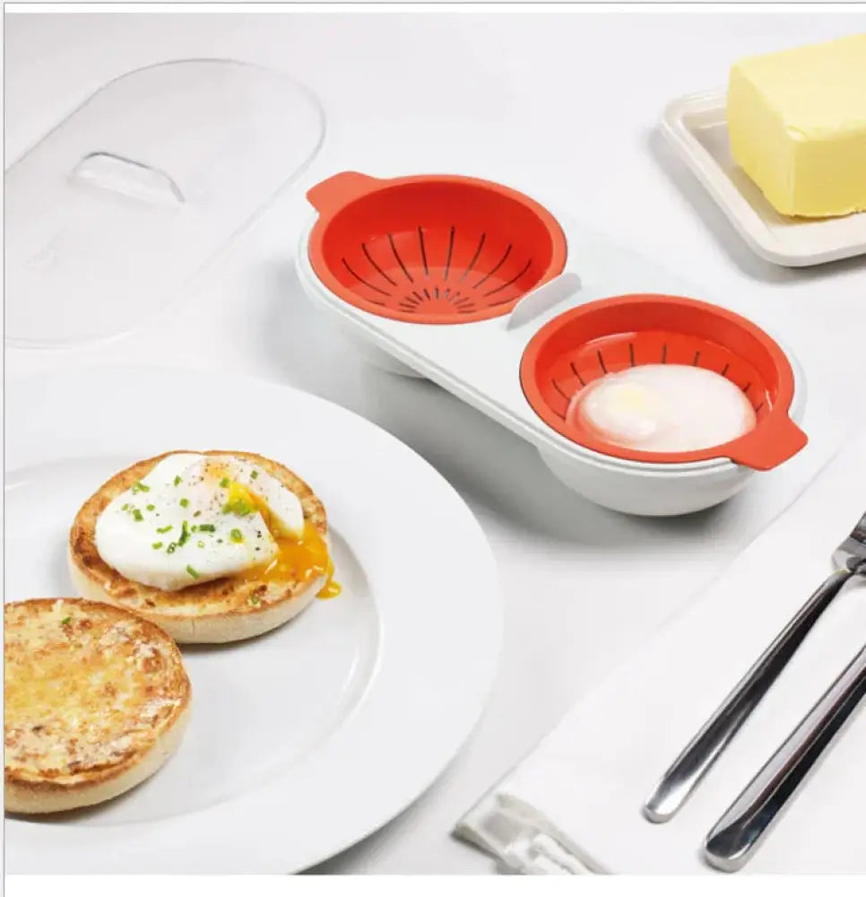 White and orange silicone microwave double cup egg poacher and boiler with two compartments for poached eggs