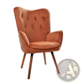 A cozy mid-century modern wingback accent chair in burnt orange velvet with tufted back and wooden legs