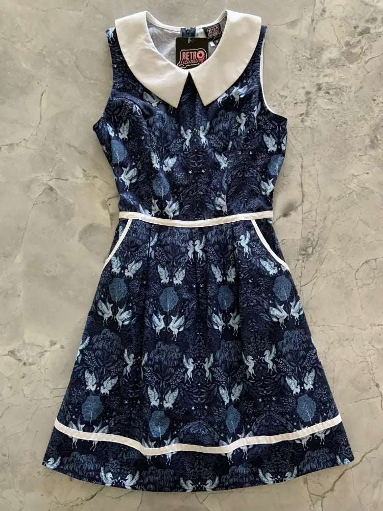 Navy blue sleeveless cotton a-line dress with white peter pan collar and whimsical fairy leaf pattern with pockets