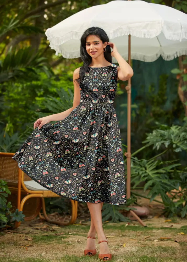 Midnight butterfly print black sleeveless cotton a-line midi dress with pastel butterfly and heart pattern