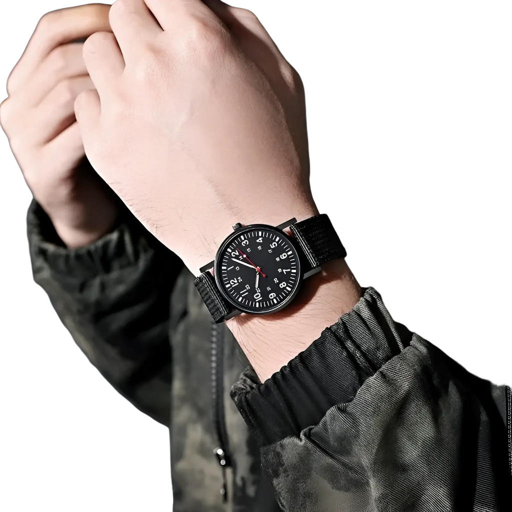 Black analog military quartz watch with matte dial white numerals red second hand and textured black fabric strap