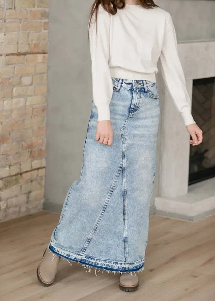 Mina frayed hem light wash denim maxi skirt featuring a light-wash fabric with frayed hem and visible stitching details