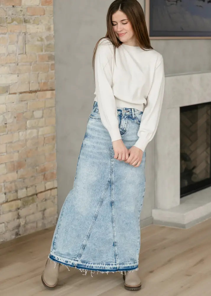 Mina frayed hem light wash denim maxi skirt with visible stitching details and distressed hem in light blue denim
