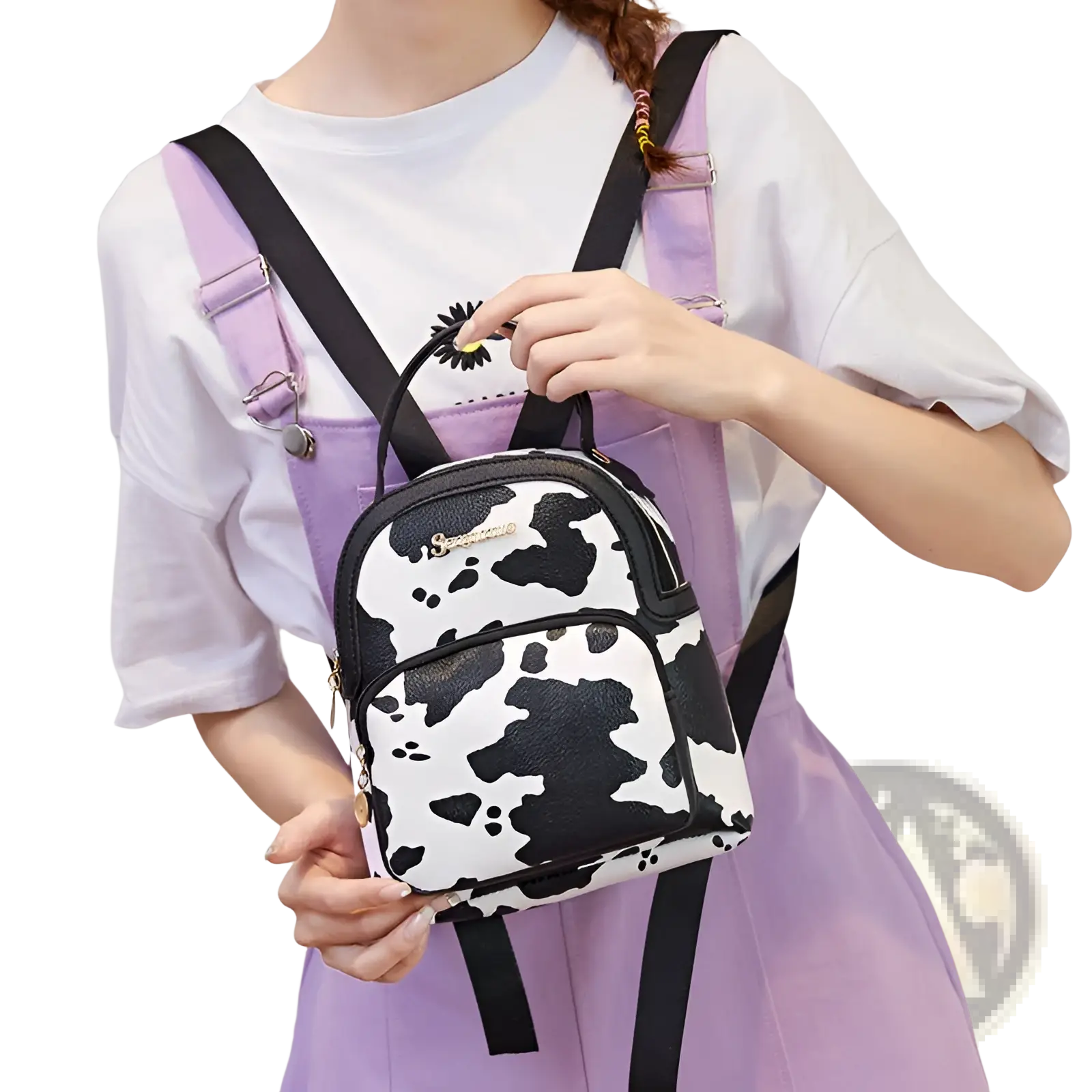 Mini backpack with a black and white cow print design and adjustable straps in korean style materials