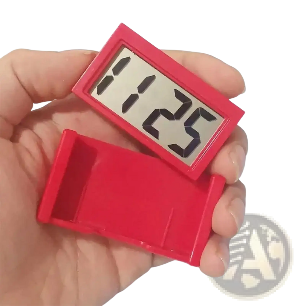 Mini car digital clock rectangular red with black numerals and silver lcd display held in hand for dashboard use