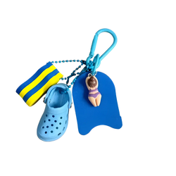 Mini clog keychain beach bag charm featuring a blue miniature croc shoe striped swim sock and buoy-shaped keychain with figurine