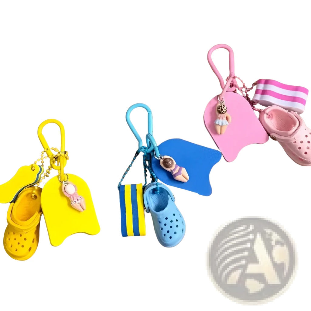 Brightly colored miniature crocs-themed mini clog keychain beach bag charm with tiny swim floats and flip-flops in yellow blue and pink