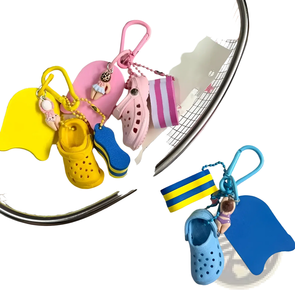 A collection of colorful miniature mini clog keychain beach bag charms in yellow pink and blue rubber material