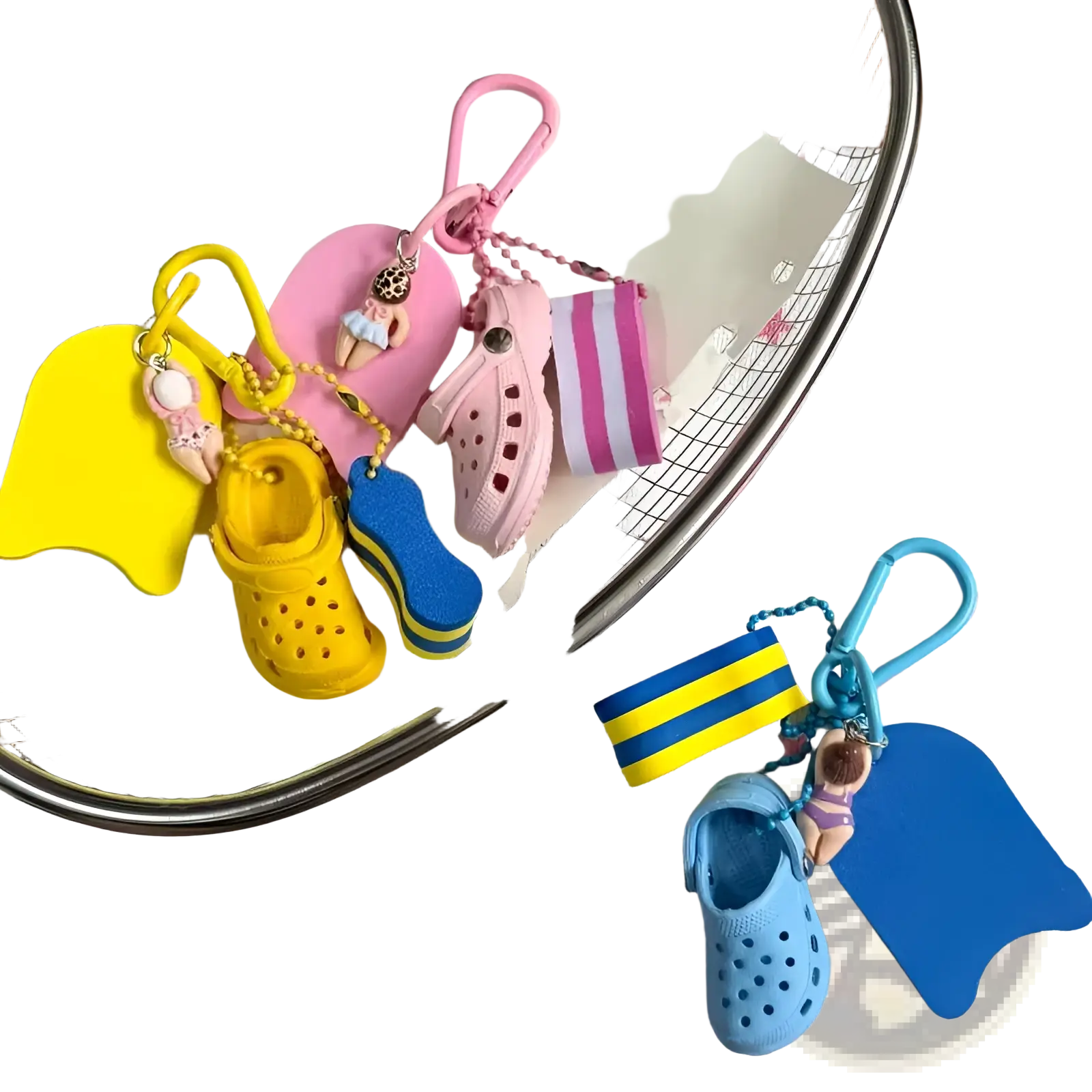 A collection of colorful miniature mini clog keychain beach bag charms in yellow pink and blue rubber material