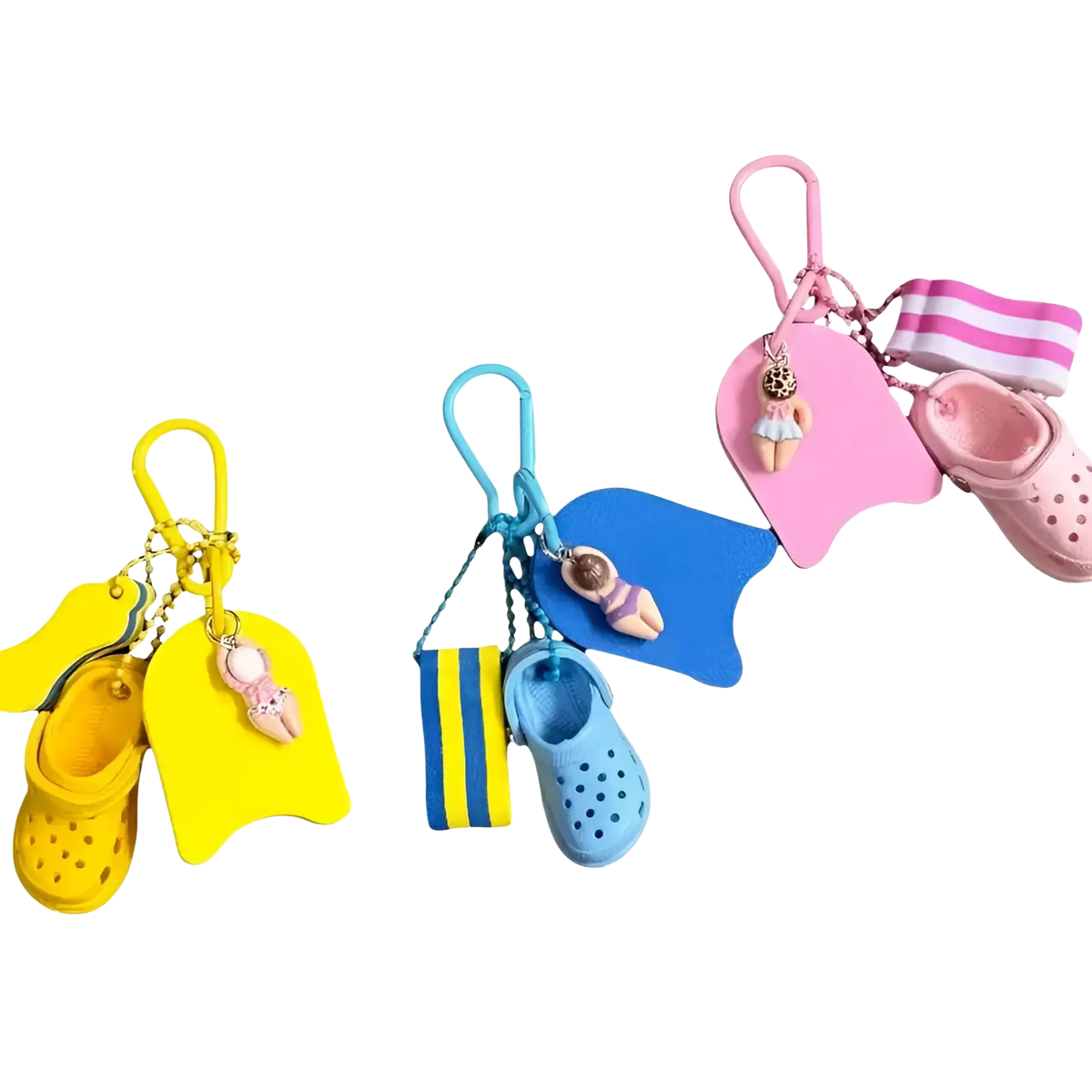 Set of three colorful miniature crocs-themed keychains with tiny shoe charms and matching swim floats in yellow blue and pink