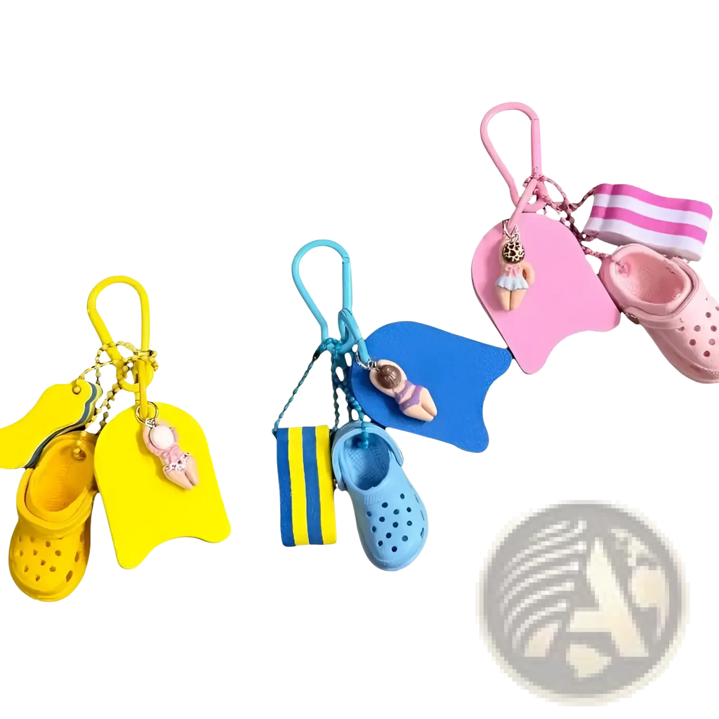 Set of three colorful miniature crocs-themed keychains with tiny shoe charms and matching swim floats in yellow blue and pink